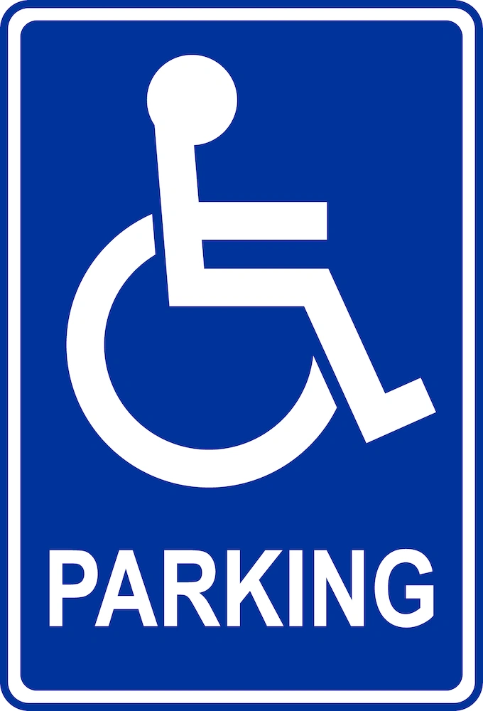 Handicap parking symbol known as the International Symbol of Access represented as a white stylized figure of a person in a wheelchair on a royal blue background
