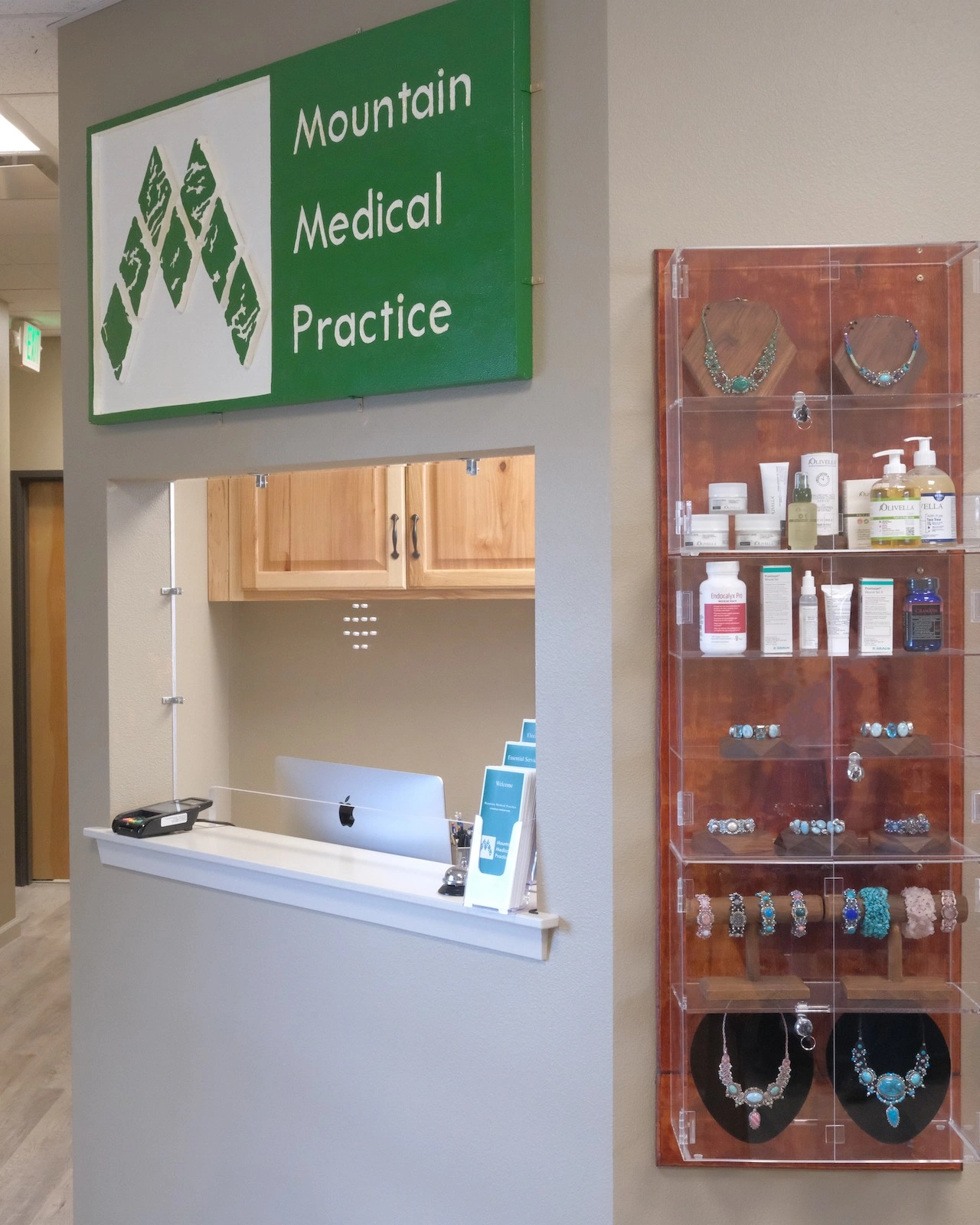 Mountain Medical Practice reception desk and gift shop display case