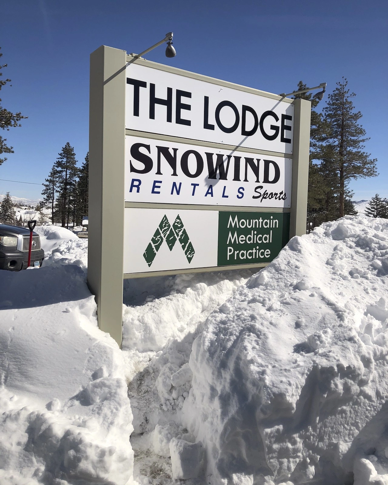 Mountain Medial Practice road sign in snow