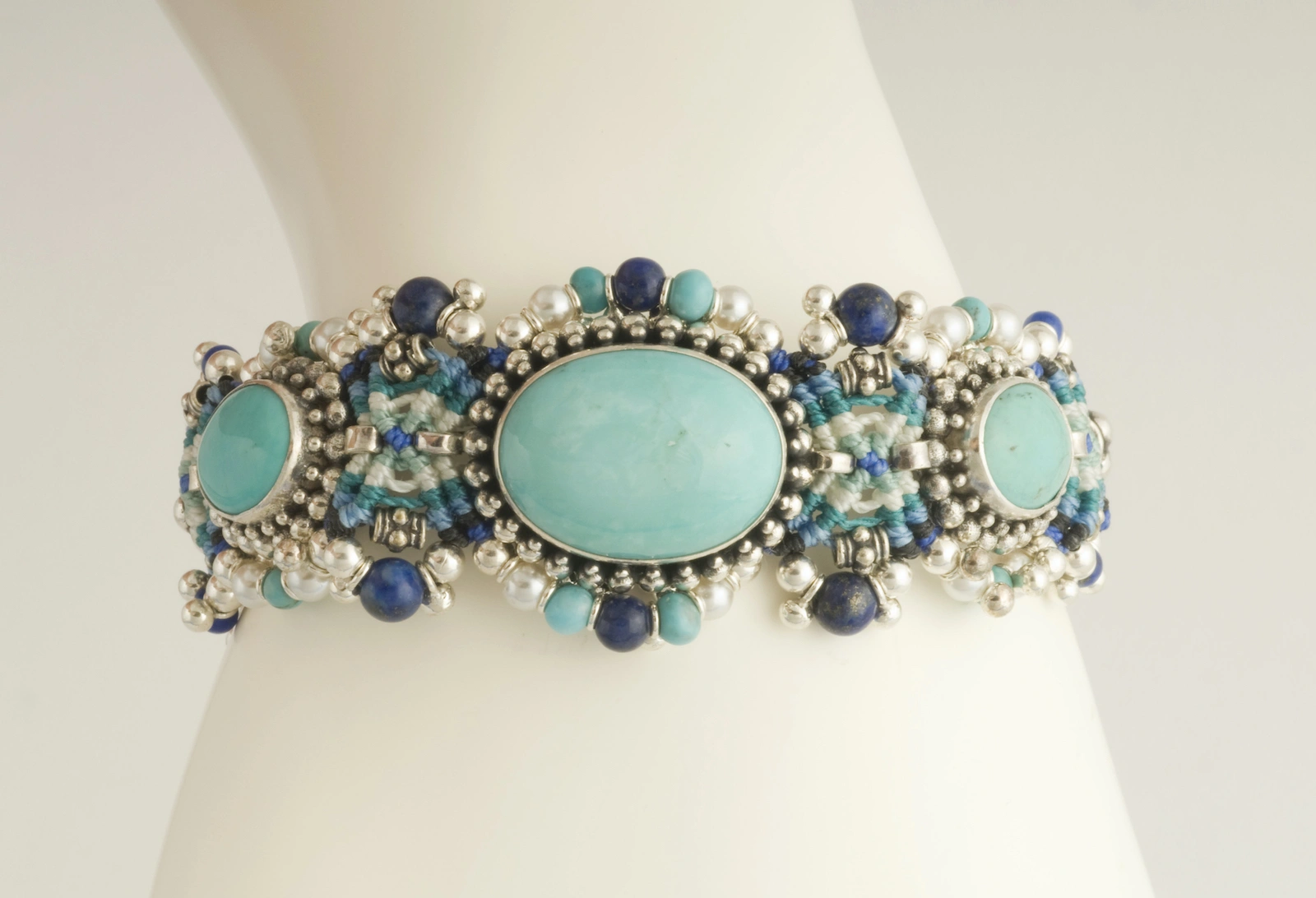 Turquoise and blue macramé nomadic knotwork style bracelet by designer Isha Elafi
