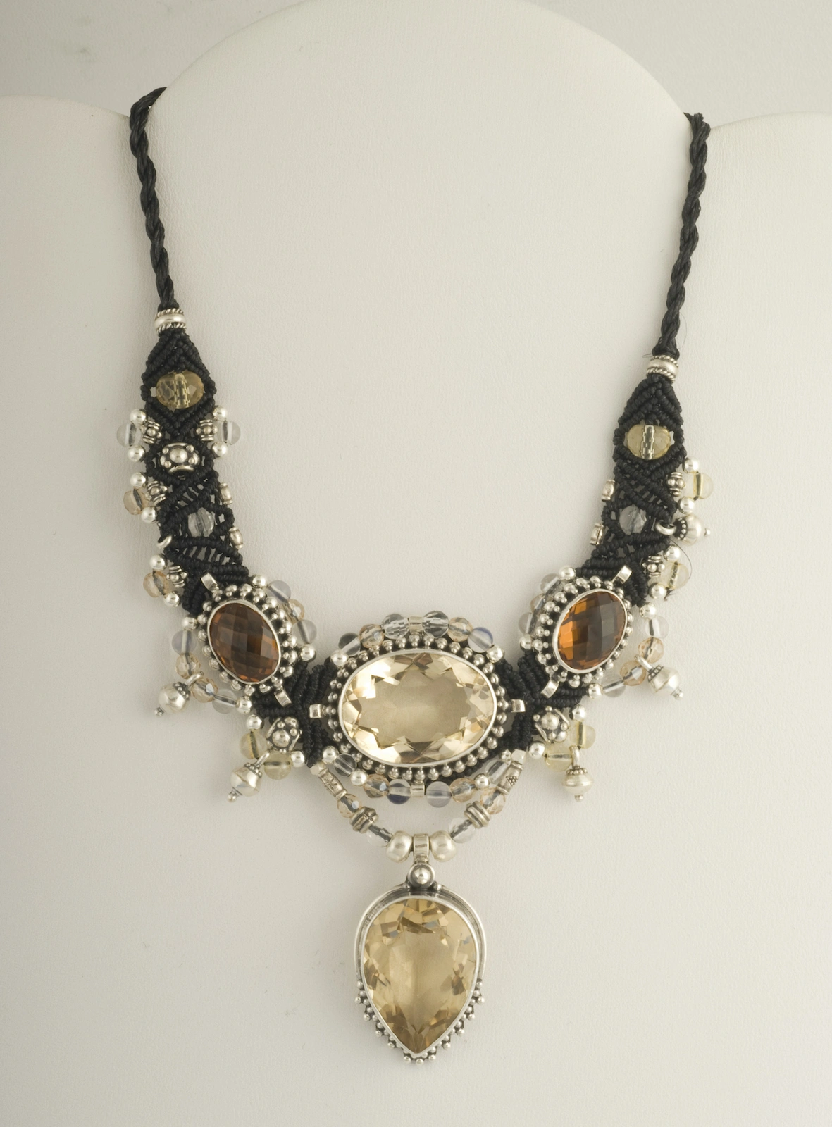 Citrine and black macramé nomadic knotwork style necklace by designer Isha Elafi