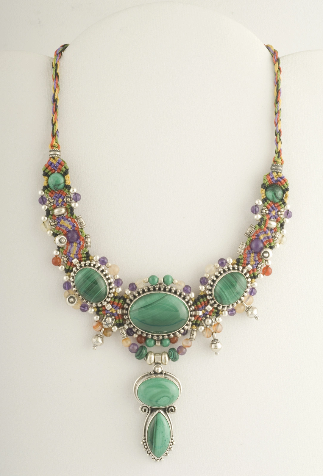 Malachite green multicolor macramé nomadic knotwork style necklace by designer Isha Elafi