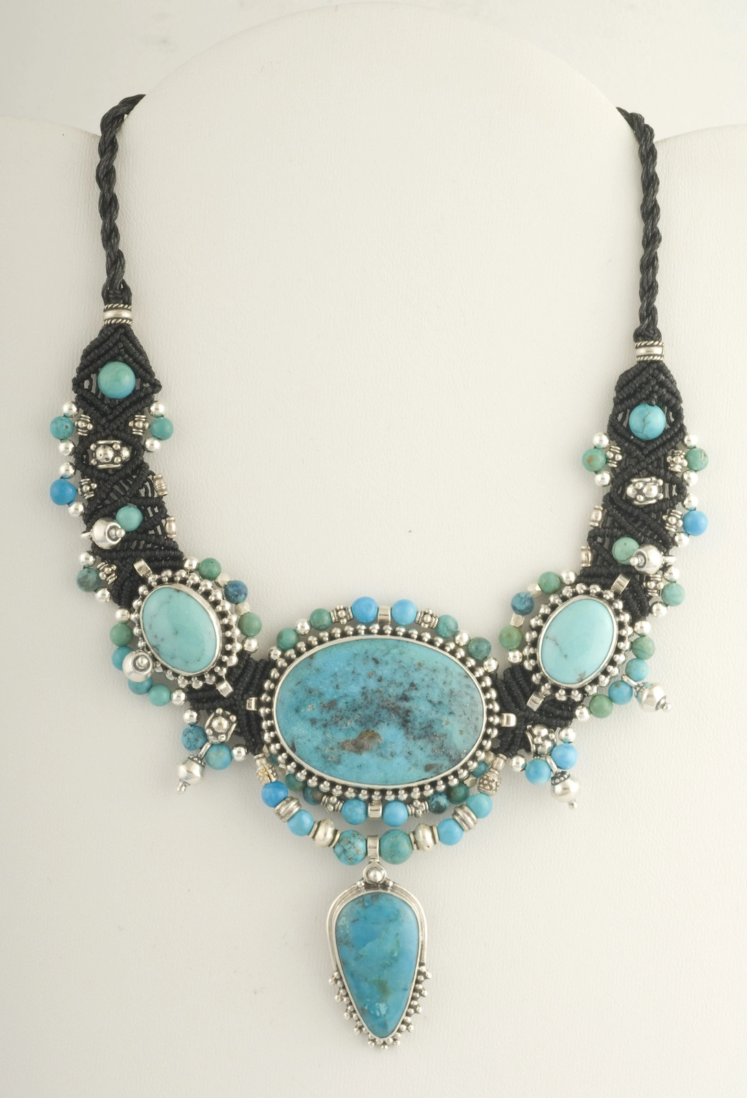Turquoise and black macramé nomadic knotwork style necklace by designer Isha Elafi