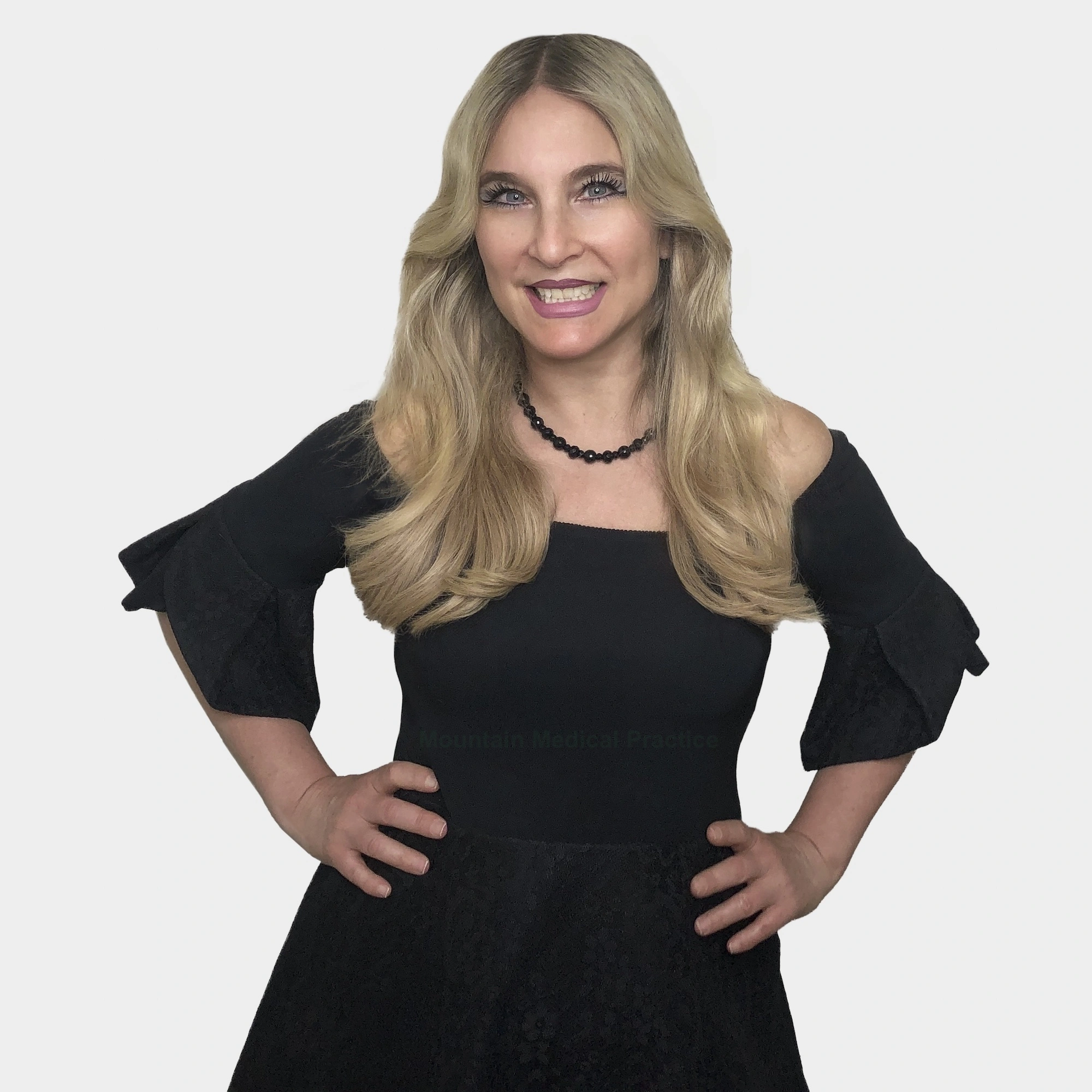 Maria Pirraglia in black beaded necklace and black off-the-shoulder Avaelle dress