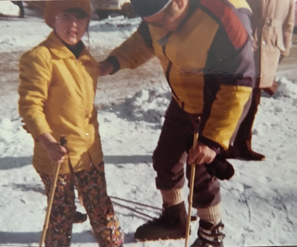 Dr. Maria Pirraglia as youngster learning to ski with Dad vintage photo