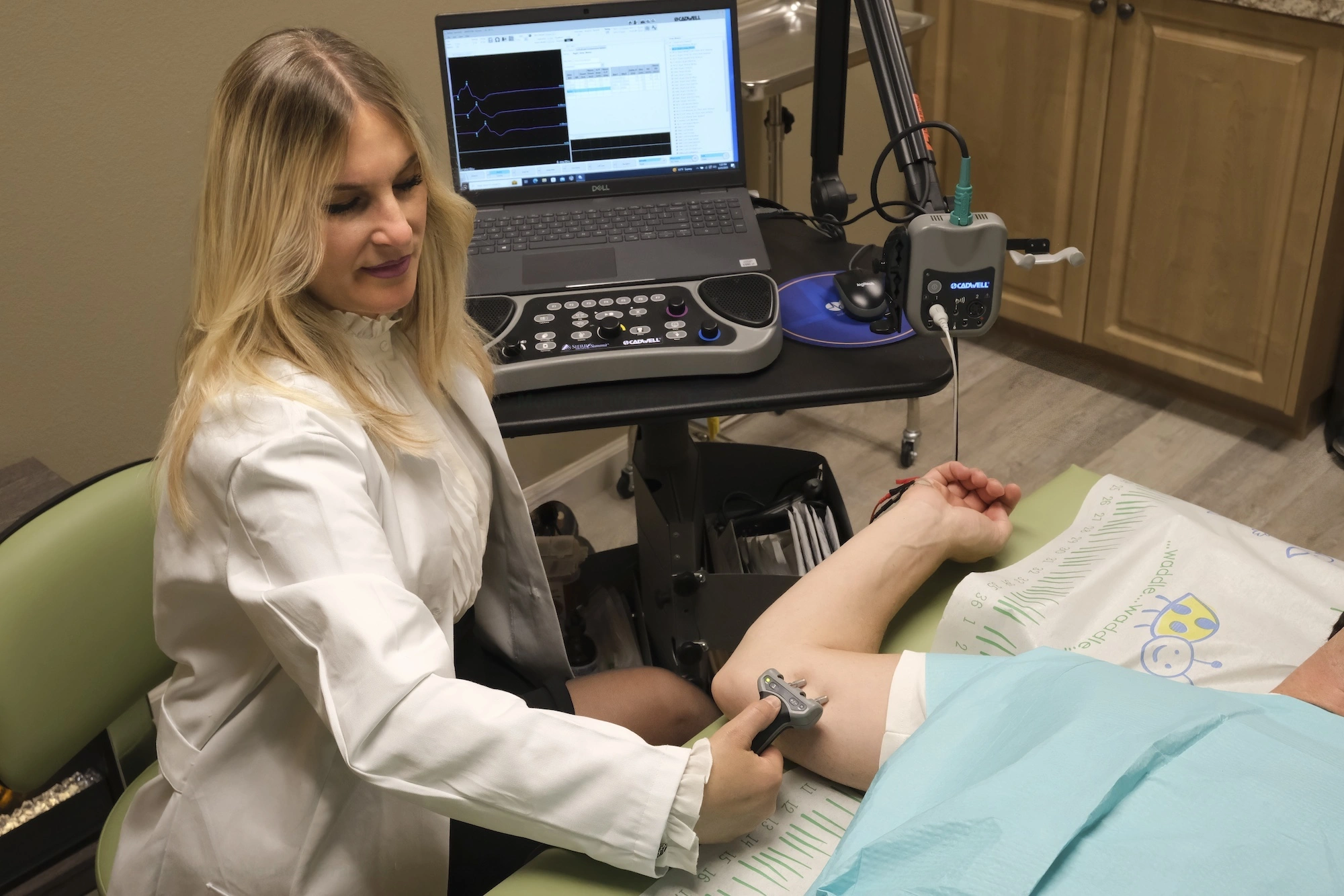 Dr. Maria Pirraglia performing ulnar motor nerve conduction studies at elbow