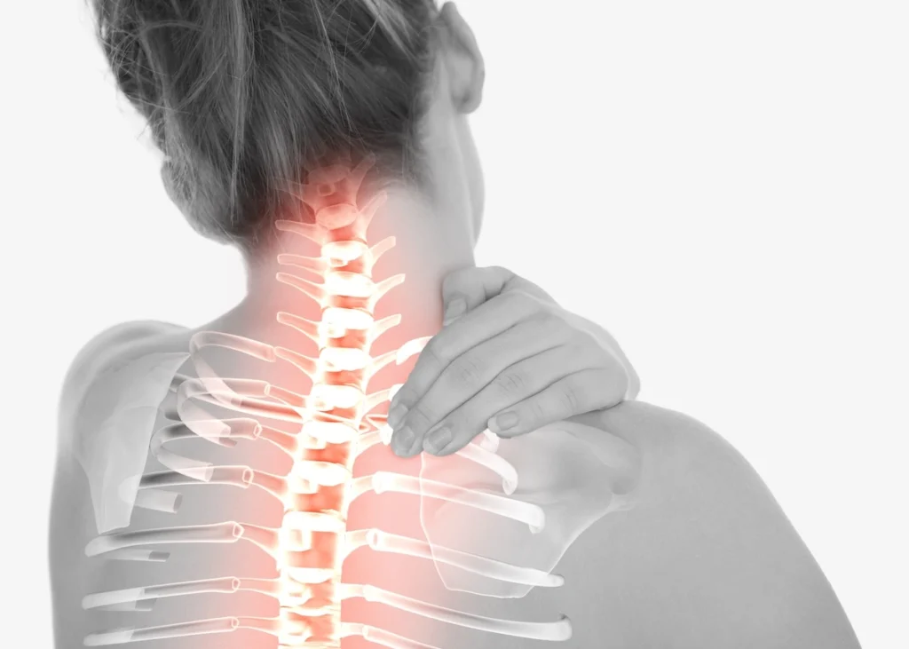 Female clutching neck in pain with inset hologram of upper spine