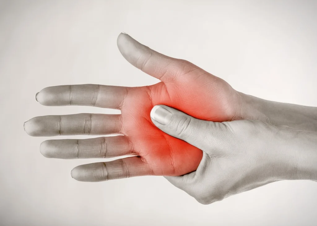 Female clutching wrist and hand in pain